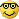 Yellow smiley face wearing large black glasses and smiling smugly.