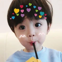 Child with a heart filter overlay on their head drinking from a straw with a playful expression.