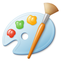 A paint palette with red, green, and yellow paint blobs next to a wooden paint brush.