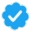 A blue badge with a white check mark in the center.