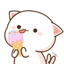 White cat with pink ears happily eating a scoop of colorful ice cream.