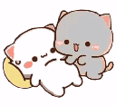 A grey cat playfully poking a sleeping white cat on a yellow pillow.