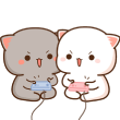 Peach and Goma cats holding game controllers with focused and excited expressions.