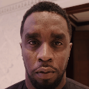 Diddy looking directly into the camera with a serious and intense expression.