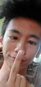 A person holding up their middle finger in a defiant gesture.