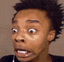 A young man making a series of exaggerated, distorted, and shocked facial expressions.