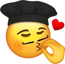 Yellow emoji wearing a black chef hat making a kissing hand gesture with a small red heart nearby.