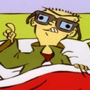 Edd from Ed, Edd n Eddy wearing glasses and pointing his finger up while laying in bed.
