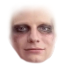 A man with dark, smudged makeup around his eyes looking directly at the camera with a deadpan expression.