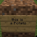 A Minecraft dirt block with a wooden sign attached that reads this is a potato.