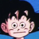 Goku with wide, blank eyes and a flat mouth expression.