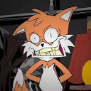 Tails the fox with a wide, distorted, and manic toothy grin staring directly forward.
