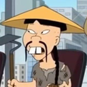 A cartoon man with a conical hat and buck teeth looking suspiciously to the side.