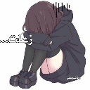 Anime girl with dark hair sitting in a fetal position while wearing a black hoodie.