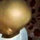 A series of frames showing a close-up of a bald head from different angles.