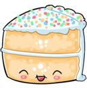 Birthday cake with a happy face and tongue out, covered in colorful sprinkles.