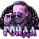 Ivan Okhlobystin wearing sunglasses and looking smug with a laurel wreath behind him and the word Goyda in neon text below.