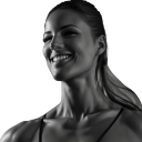 Woman with a chiseled jawline and a confident, stoic smile.