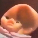 Baby with a skeptical expression giving a side-eye glare.
