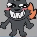 A dark gray creature with a wide, toothy grin and pink blushing cheeks looking mischievous.