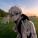 Anime boy with white hair making a peace sign gesture in front of a soccer field.