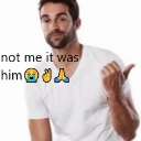 Man in a white shirt pointing to the side with text overlay reading not me it was him.