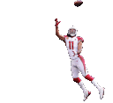 Larry Fitzgerald in a white and red uniform reaching high to catch a football.