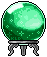 A glowing green crystal ball sitting on a gray metal stand in pixel art style.