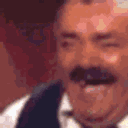 El Risitas laughing hysterically with his mouth wide open and eyes squinted.