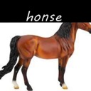 A brown toy horse stands against a white background with the text honse written in a black bar above it.