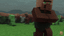 Minecraft villagers standing near a wooden structure in a grassy field.