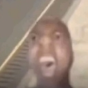 Distorted human face with a wide-eyed, shocked expression.