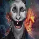 A distorted face with a wide, unsettling grin and dark, moody lighting.