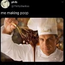 A chef in a white uniform holds up a glob of dark chocolate with a serious expression.